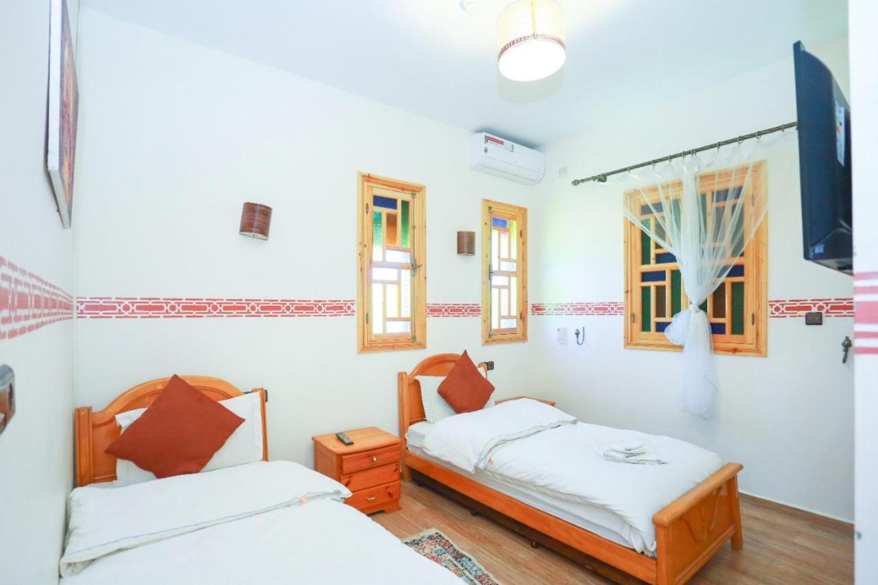 Maison D'Hotes Tinwitchi 艾济拉勒 外观 照片